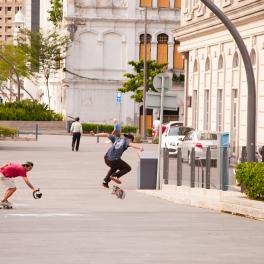 Youth skateboarding on the city sidewalk