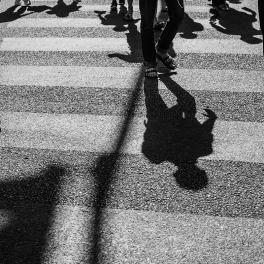 Silhouettes on a crosswalk